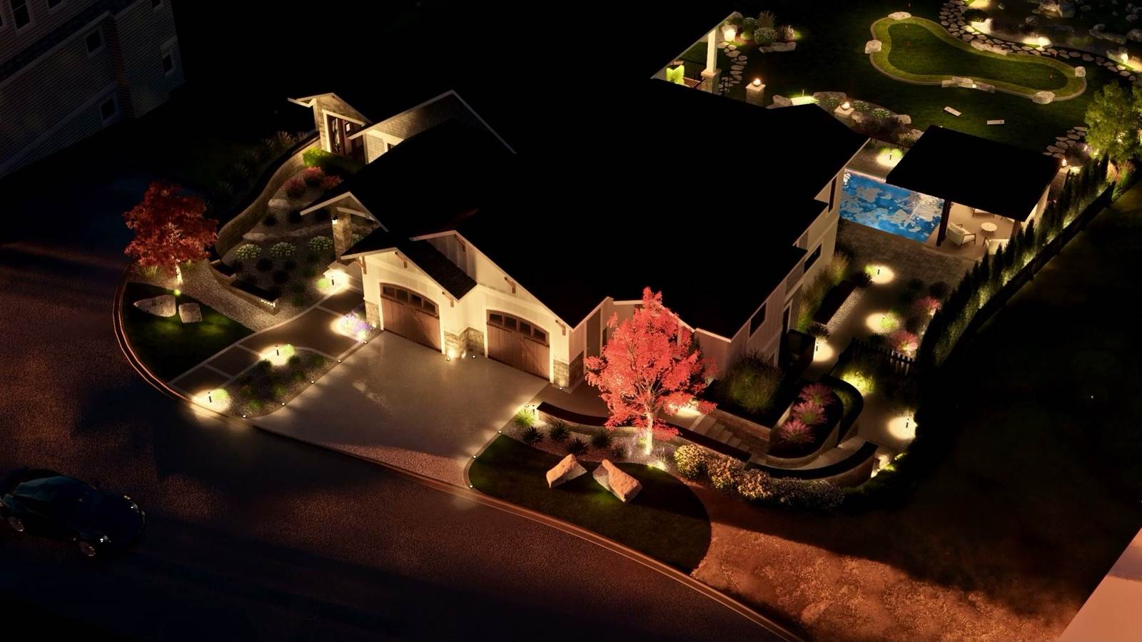 Aerial night view of a lit landscape design